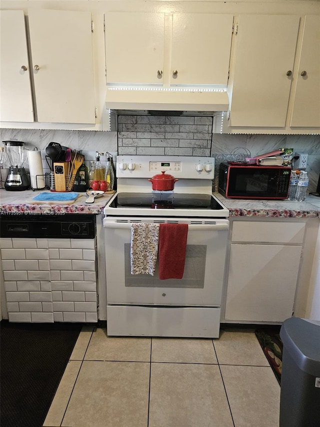 kitchen featuring light tile patterned floors, white cabinetry, backsplash, and white electric range