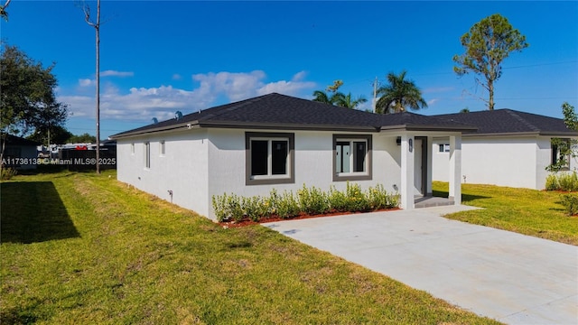 view of front of property with a front lawn