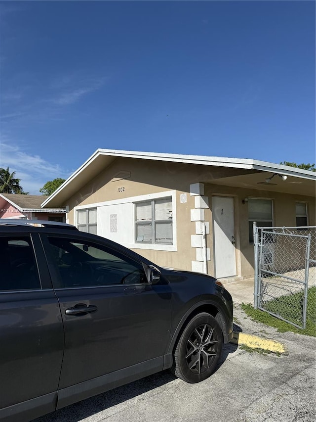 view of side of property featuring a carport