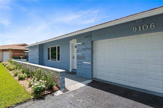 view of front of property featuring a garage