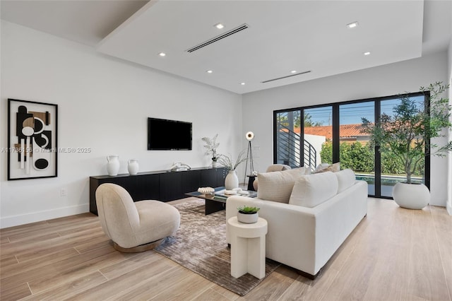 living room with light hardwood / wood-style floors