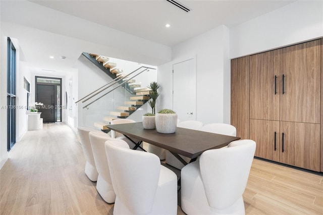 1247 SW 13th Ave, Miami, FL 33135 - dining area featuring stairway, light wood-style flooring, and recessed lighting