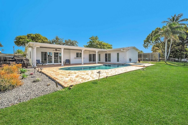 rear view of house with a yard, a patio area, and ceiling fan