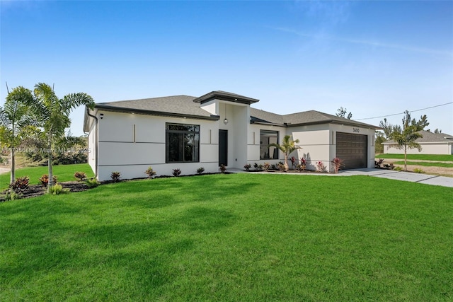 view of front of house featuring a garage and a front lawn