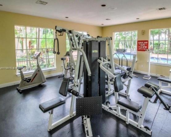 workout area with visible vents and baseboards
