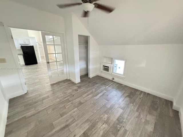 bonus room featuring lofted ceiling, ceiling fan, and light hardwood / wood-style flooring