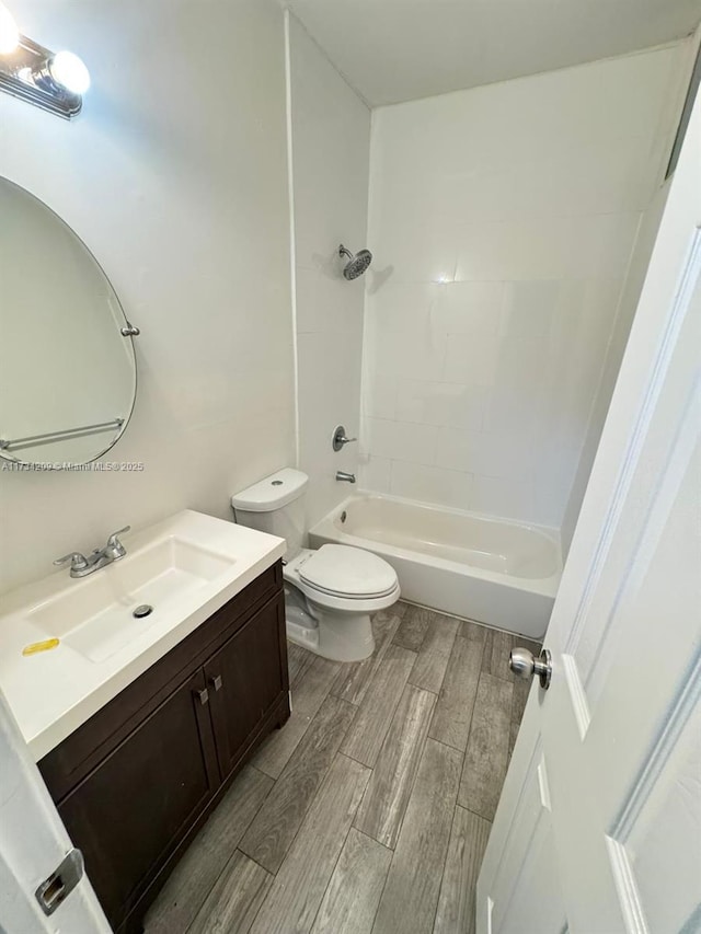 full bathroom with vanity, toilet, and tiled shower / bath