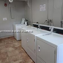 laundry area with washing machine and clothes dryer