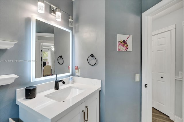 bathroom featuring vanity and hardwood / wood-style floors