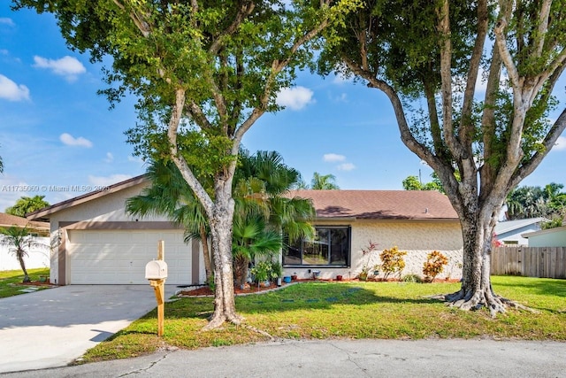 ranch-style home with a garage and a front lawn