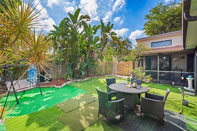 view of patio / terrace featuring a sunroom