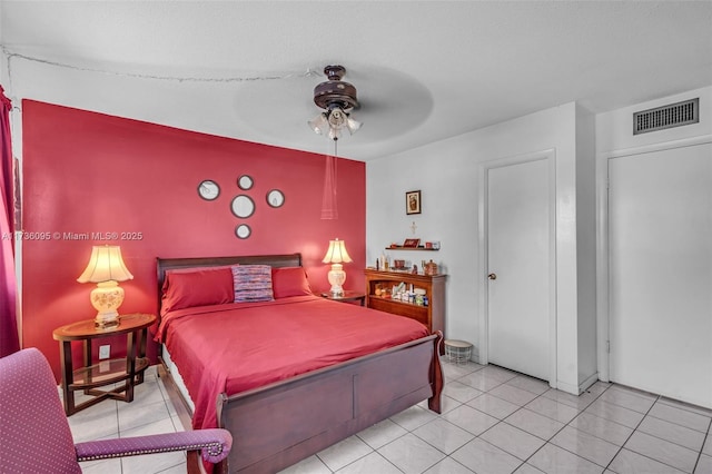 bedroom with light tile patterned flooring and ceiling fan