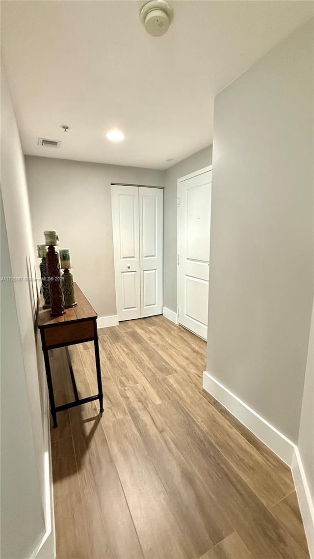 hallway featuring hardwood / wood-style flooring