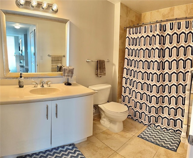 bathroom featuring tile patterned flooring, vanity, a shower with curtain, and toilet