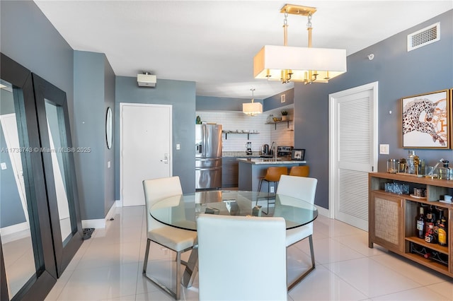 dining area featuring light tile patterned floors