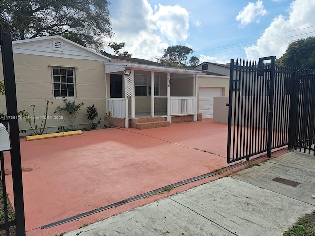 rear view of house with a garage