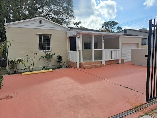 view of front of house with a garage and covered porch