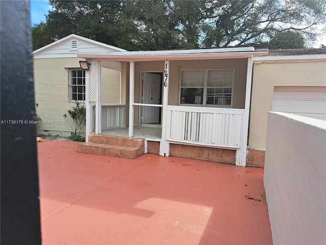 doorway to property featuring a garage