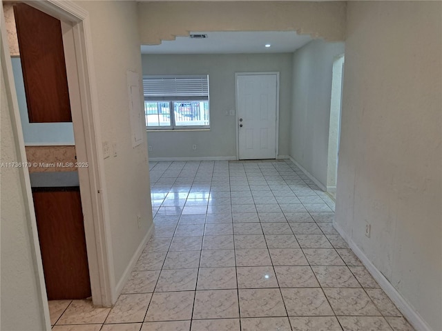 hallway featuring light tile patterned floors