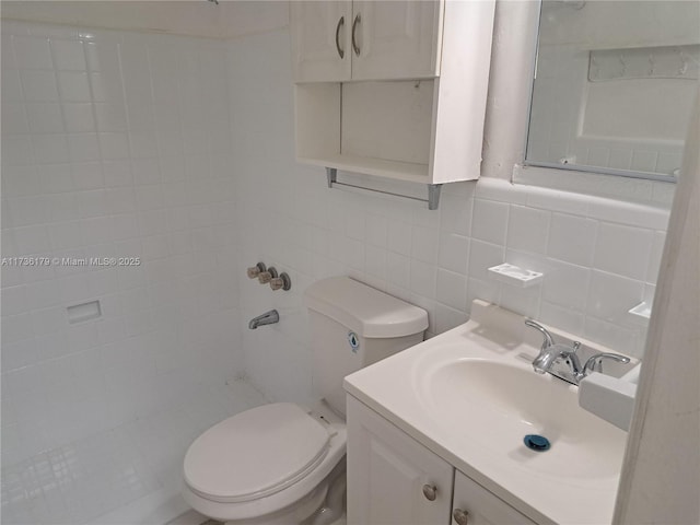 bathroom with walk in shower, toilet, tasteful backsplash, tile walls, and vanity