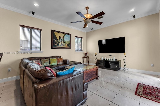 living room with light tile patterned floors, ornamental molding, and baseboards