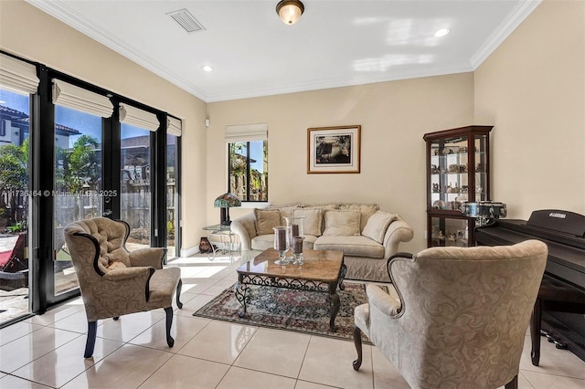 living room featuring visible vents, crown molding, and light tile patterned floors