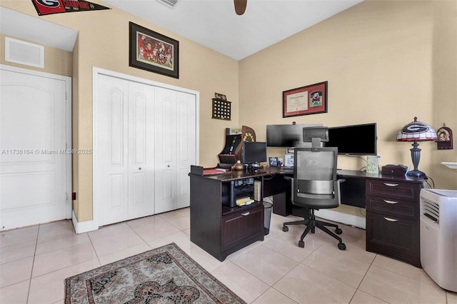 office space with light tile patterned flooring, visible vents, and a ceiling fan