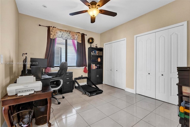 tiled home office with ceiling fan