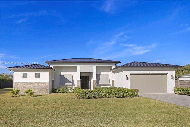 prairie-style home featuring a garage and a front lawn