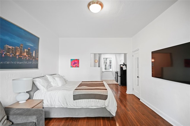 bedroom featuring dark wood-type flooring