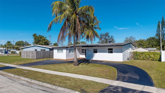 ranch-style house with a front yard