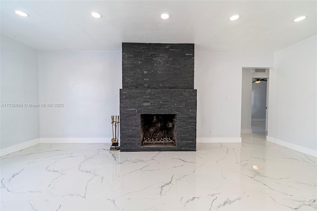 unfurnished living room with a large fireplace