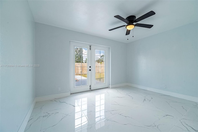 spare room with ceiling fan and french doors