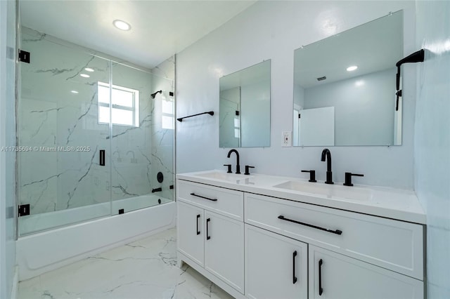 bathroom featuring vanity and combined bath / shower with glass door