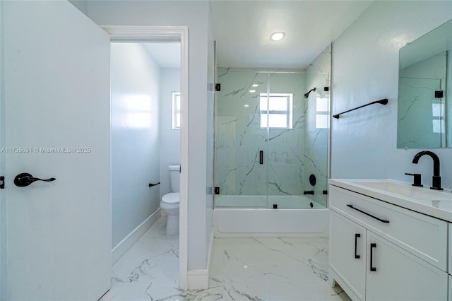 full bathroom with vanity, combined bath / shower with glass door, and toilet