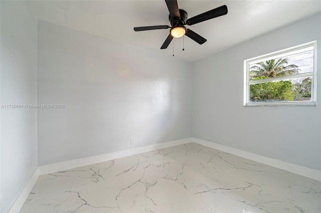 spare room with ceiling fan