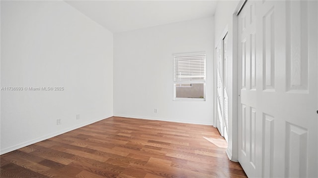 spare room featuring hardwood / wood-style flooring