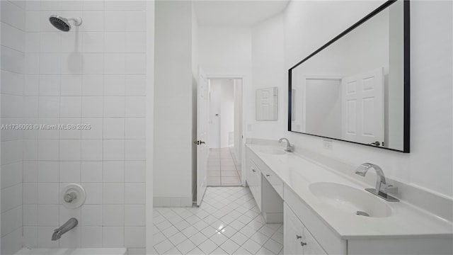 bathroom featuring vanity, tiled shower / bath combo, and tile patterned floors