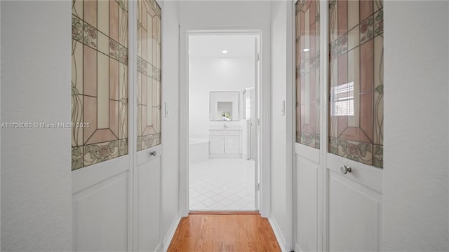 hallway featuring light hardwood / wood-style flooring