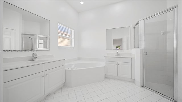 bathroom with vanity, plus walk in shower, and tile patterned flooring