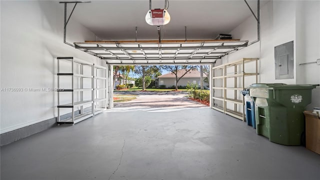 garage featuring a garage door opener and electric panel