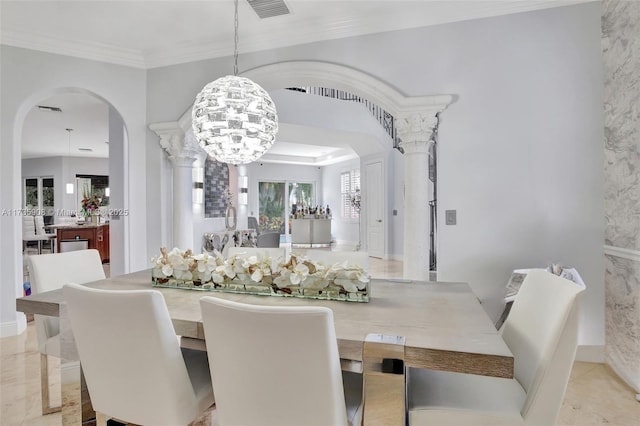 dining space with crown molding, a tray ceiling, and a notable chandelier