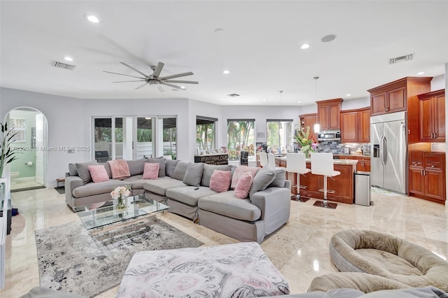 living room featuring ceiling fan