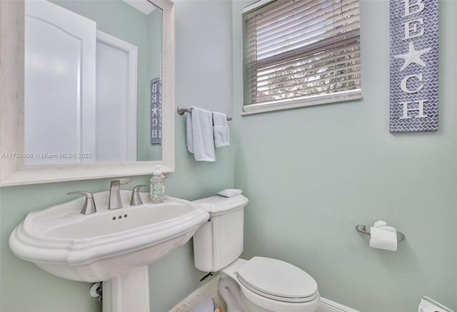 bathroom featuring sink and toilet