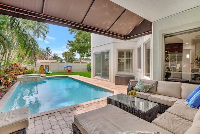 view of swimming pool with an outdoor hangout area, a patio, and an in ground hot tub