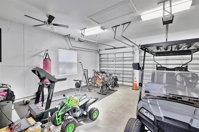 garage with ceiling fan and a garage door opener