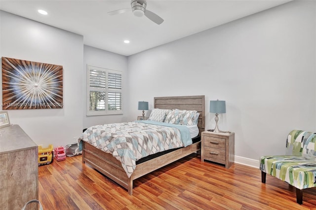 bedroom featuring ceiling fan and light hardwood / wood-style flooring