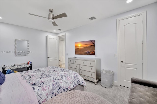 bedroom with light colored carpet and ceiling fan