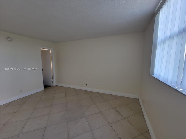 spare room featuring a textured ceiling