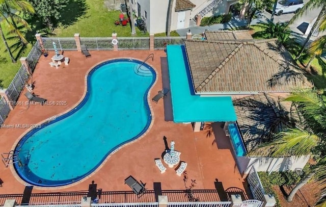 view of swimming pool with a patio area